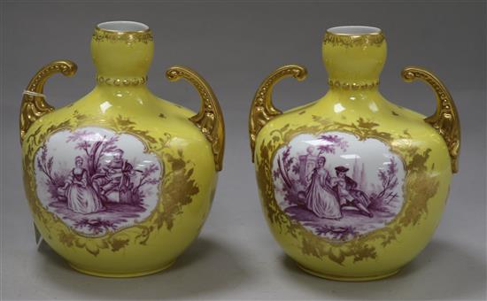 A pair of Dresden, in the Meissen style, yellow and mauve vases